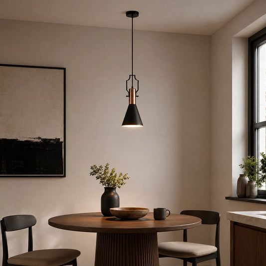 Black pendant lamp with wooden detail hanging above round dining table