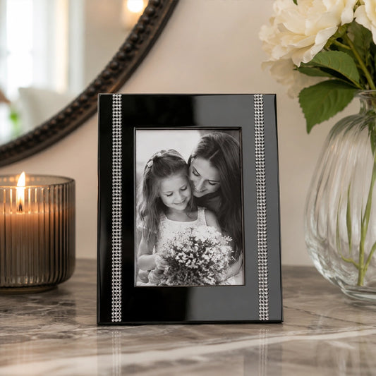 Black steel photo frame with textured edge on dressing table