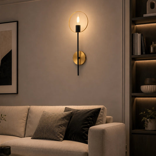 Black and gold wall light above sofa in modern living room