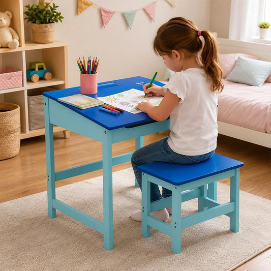 Blue children’s desk and stool set with child drawing in bedroom