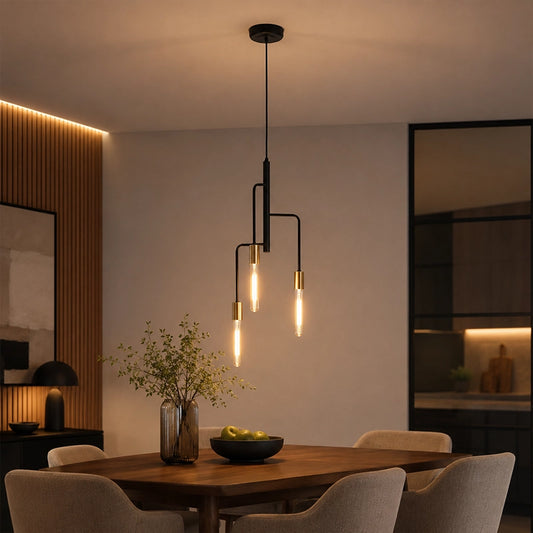 Modern gold and black pendant light over wooden dining table