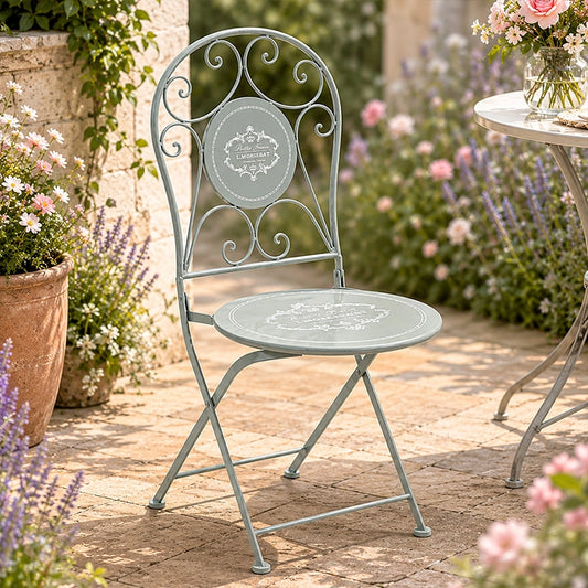 Grey metal folding garden chair with decorative floral backrest