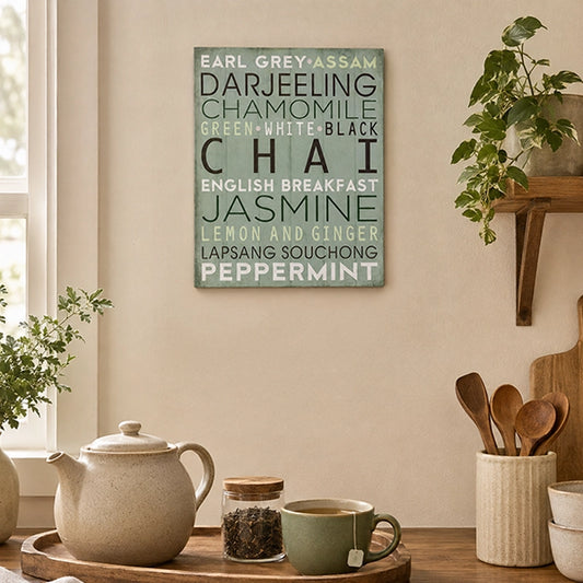 Wooden kitchen wall plaque featuring different tea varieties displayed above a kitchen worktop