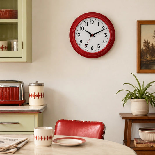 Red wall clock above dining table with red chair and home decor