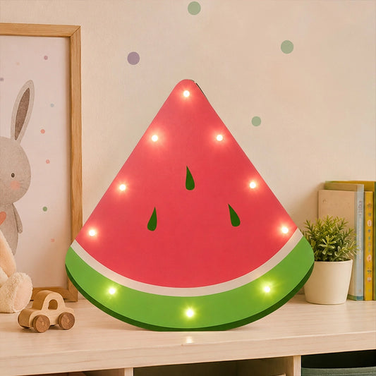 Watermelon LED light box on kids room shelf with soft glowing bulbs