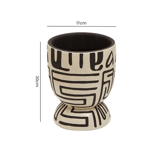 Size reference for a white and black geometric patterned planter with height and width measurements labelled