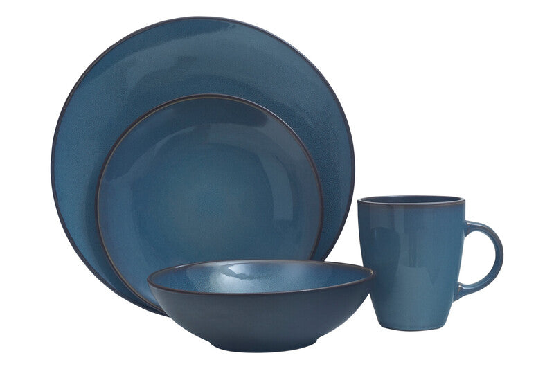 A stylish blue dinner set featuring plates, bowls, and cups arranged elegantly on a table.