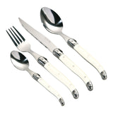 Elegant cutlery set featuring stainless steel knives, forks, and spoons arranged neatly on a wooden table.