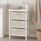 White bathroom storage unit with three woven maize baskets and toiletries on top