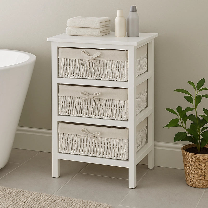 White 3-basket storage unit with woven drawers beside bathtub and plant