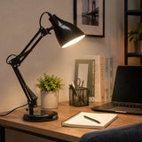 Black adjustable desk lamp with warm light on study table