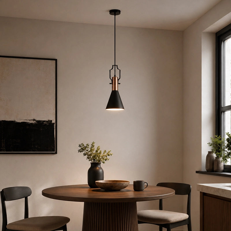 Black pendant lamp with wooden detail hanging above round dining table