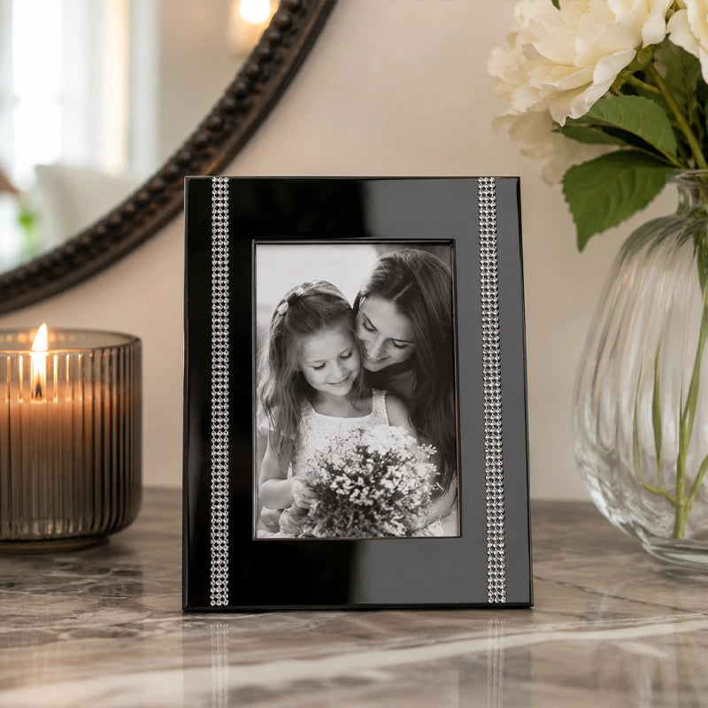 Black steel photo frame with textured edge on dressing table