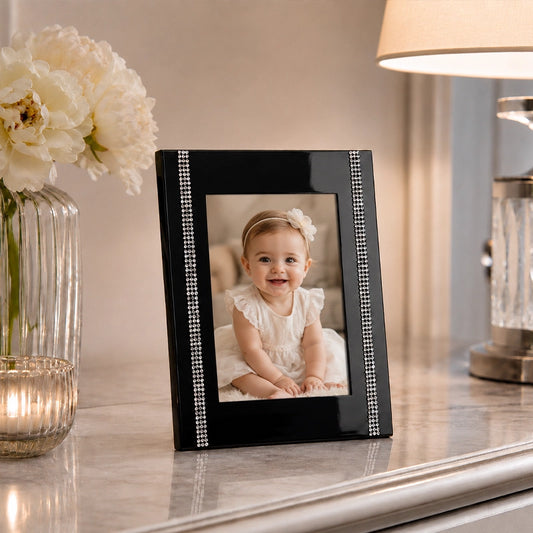 Black steel photo frame with dotted border displaying portrait picture