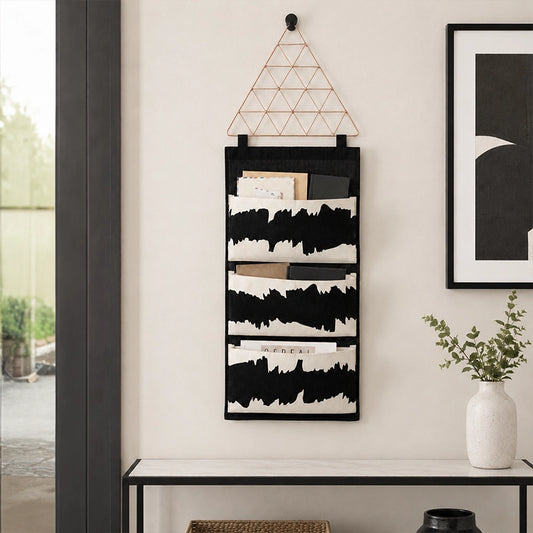 Black and white fabric wall pocket organiser with three storage compartments for letters and documents