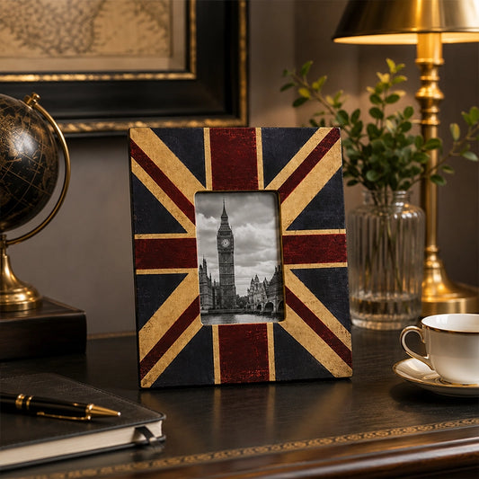 Black and gold 4x6 photo frame with decorative design on side table