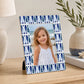 Blue decorative photo frame with geometric border on tabletop