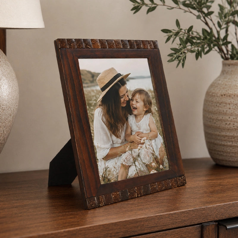 Brown wooden photo frame with classic finish displaying family picture