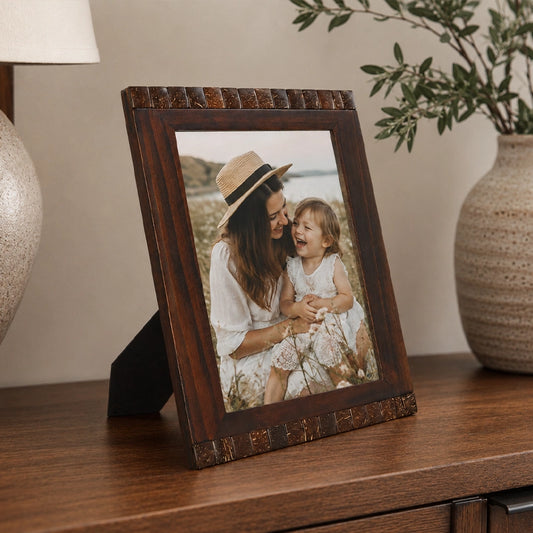 Brown wooden photo frame with classic finish displaying family picture