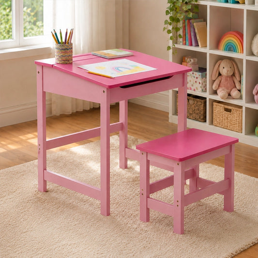 Pink kids desk and stool set with drawing paper in playroom