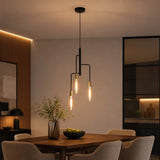 Modern gold and black pendant light over wooden dining table 