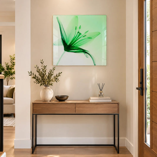 Green floral glass wall art with an abstract leaf design styled above a wooden hallway console