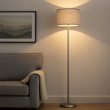Grey shade floor lamp beside armchair in modern living room