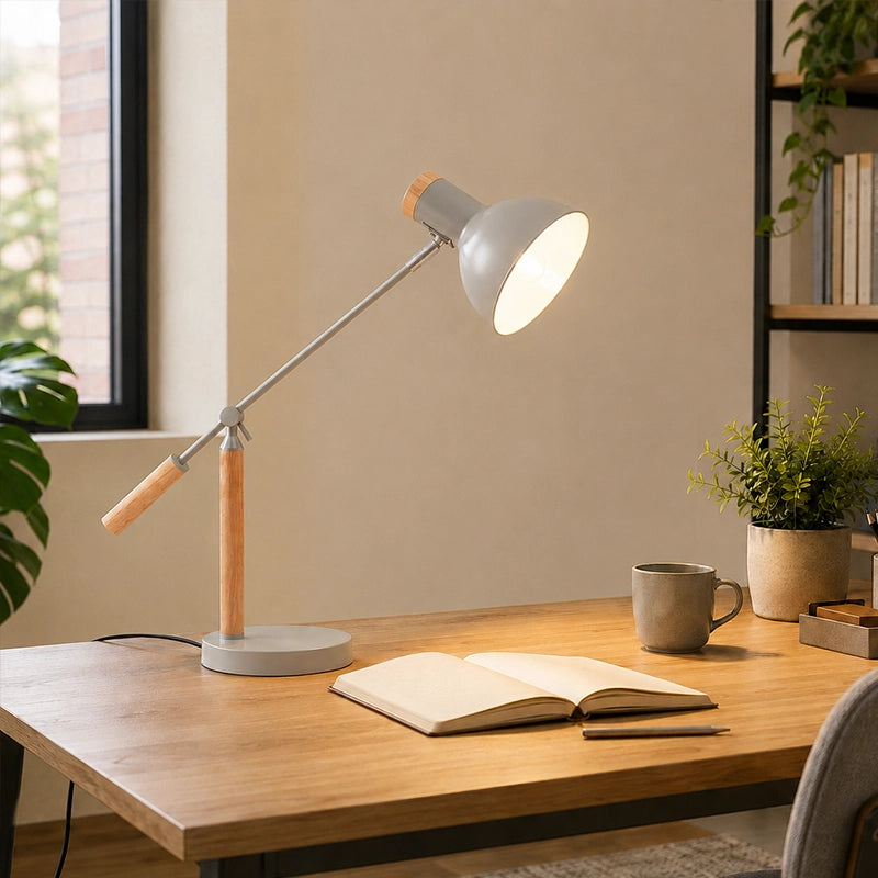 Grey adjustable table lamp with wooden handle on home office desk