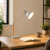 Grey adjustable table lamp with wooden handle on home office desk