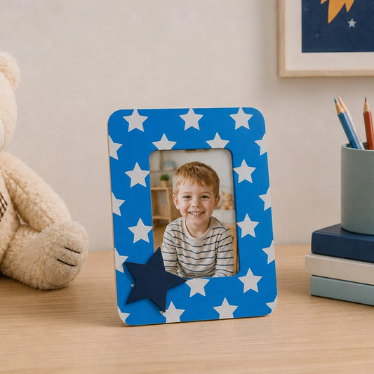 Blue kids photo frame with star design displaying child photograph