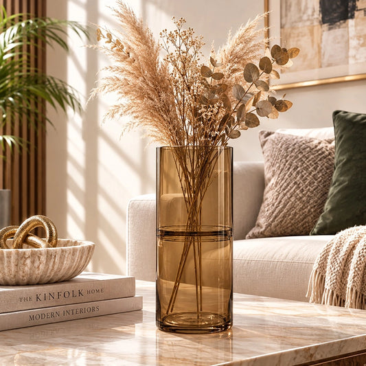 Large brown glass vase with dried pampas and foliage styled on a living room coffee table
