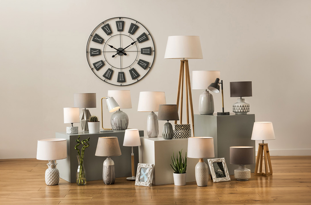 Modern Lighting collection with table lamps, floor lamps and decorative wall clock in a modern interior
