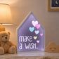 Make a wish LED light box with hearts on bedside table in kids room