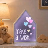 Make a wish LED light box with hearts on bedside table in kids room
