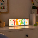 Peace LED light box with colourful letters on kids bedroom dresser