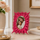 Pink floral photo frame with sunburst design displaying portrait photo