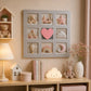 Red heart multi photo wall frame with nursery pictures in kids room