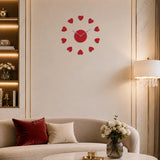 Red plastic heart wall clock above sofa in warm living room setting