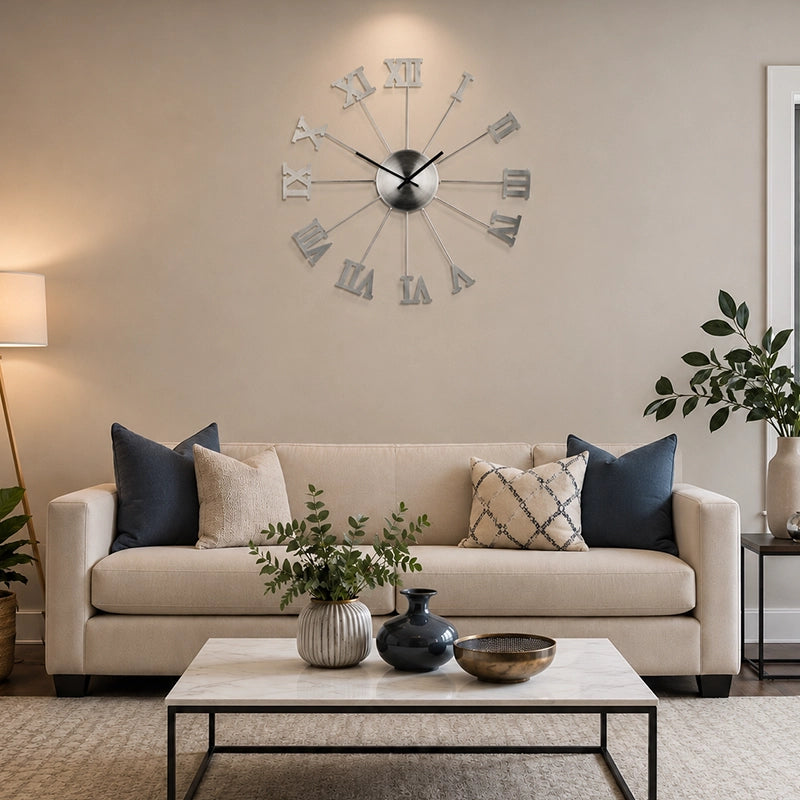 Silver metal wall clock with Roman numerals above living room sofa