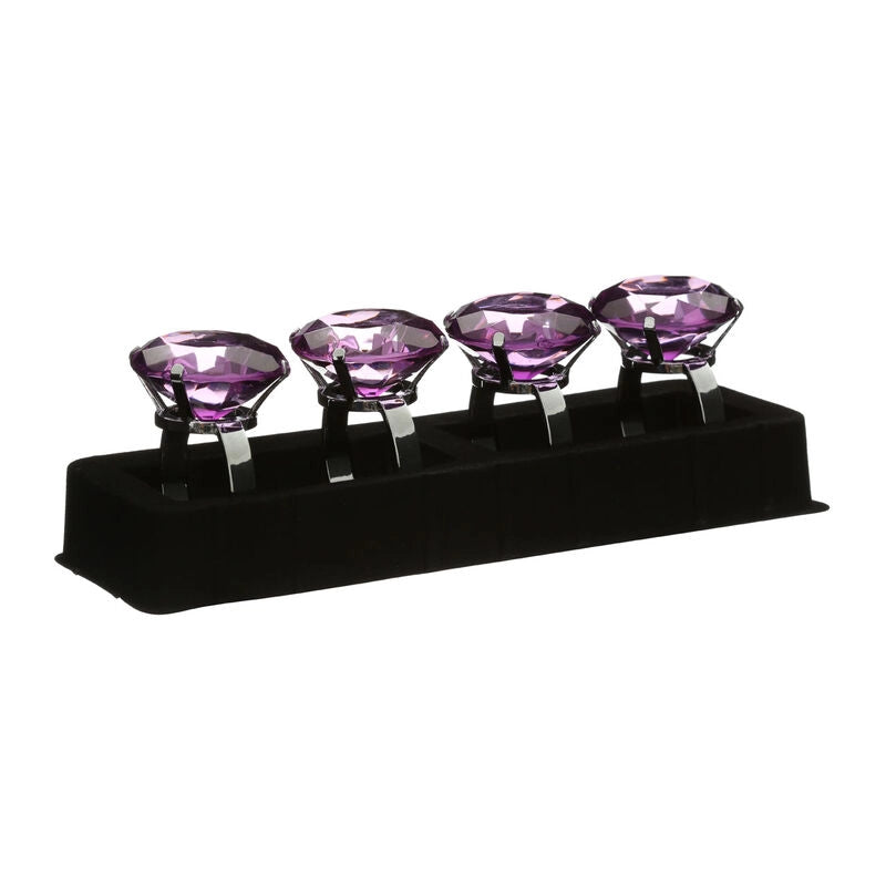Set of four purple diamante napkin rings with faceted crystal tops in a black presentation holder