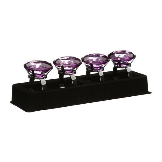 Set of four purple diamante napkin rings with faceted crystal tops in a black presentation holder