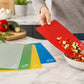 Set of five flexible colour-coded chopping boards for preparing and transferring vegetables