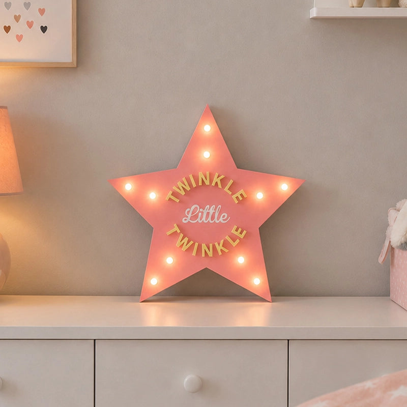 Star shaped LED marquee light on children’s bedroom dresser