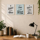 Set of three wooden motivational quote plaques displayed above a home office desk