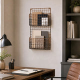 Wall mounted magazine rack with black wire frame and wooden shelves