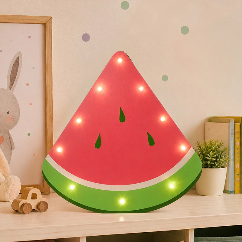Watermelon LED light box on kids room shelf with soft glowing bulbs