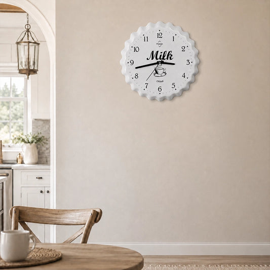 White metal wall clock with milk design and black numbers in kitchen dining area
