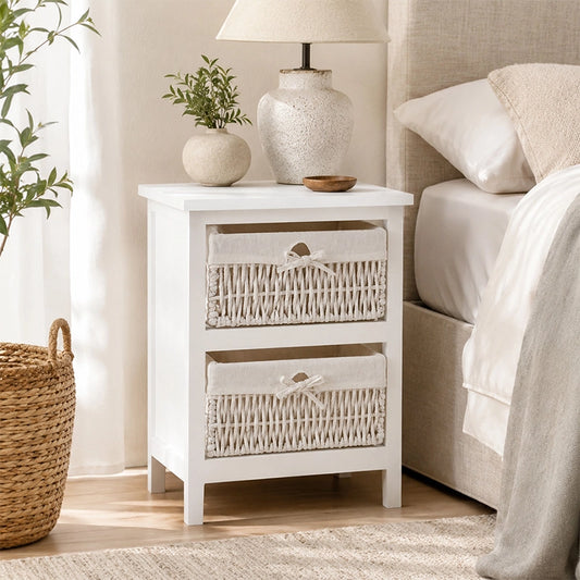 White bedside storage unit with two maize baskets, lamp and neutral bedroom decor