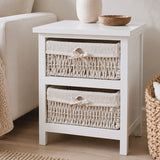 White storage unit with two maize baskets beside sofa