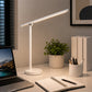 White touch desk lamp with LED light on home office table
